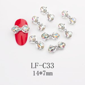 Fluga med Diamanter nagelsmycken i vit högkvalitativt. Bow tie Diamonds nail jewelry för nail art, nageldekoration och andra konstprojekt Modell LF-C33