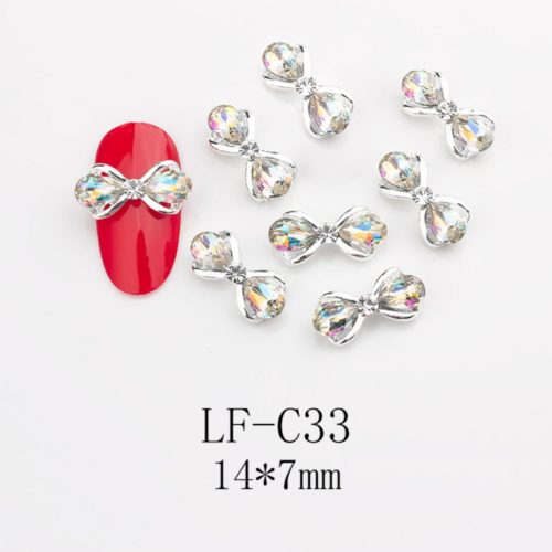 Fluga med Diamanter nagelsmycken i vit högkvalitativt. Bow tie Diamonds nail jewelry för nail art, nageldekoration och andra konstprojekt Modell LF-C33